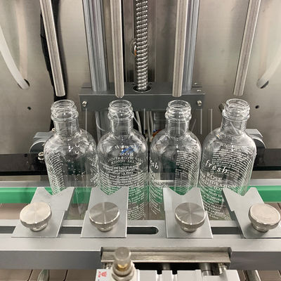Machine de remplissage et de fermeture de bouteilles d'huile liquide personnalisée