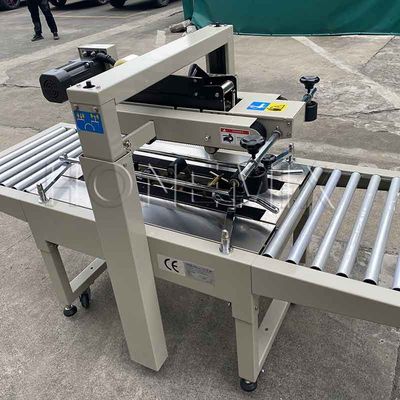 220V / 50HZ machine d'emballage automatique 12mm carton boîte scellante du ruban adhésif